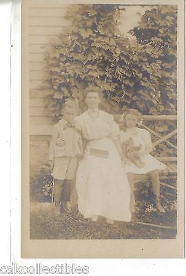 RPPC-Woman with Boy and Girl-Girl Holding Teddy Bear and Boy with Gun #2 - Cakcollectibles