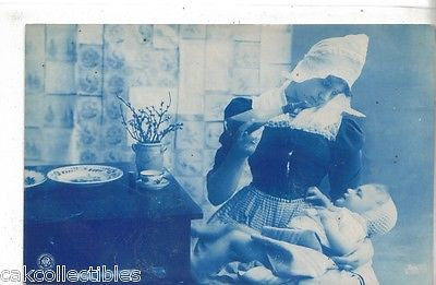 RPPC-Dutch Woman feeding Baby 1908 - Cakcollectibles - 1