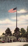 Linen postcard Old Glory at Post Headquarters,Gulfport Field - Gulfport,Mississippi
